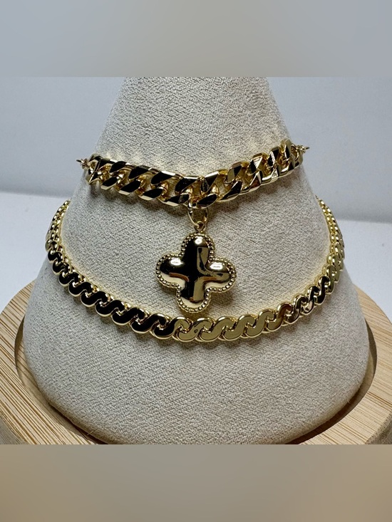 Jewelry - Two 18k gold filled bracelets with cuban style chains, and a clover pendant.